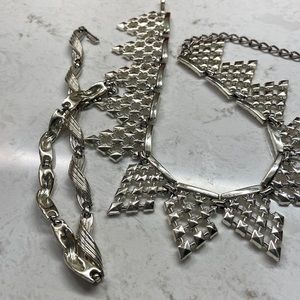 2 silver tone necklaces. One is 17” and the other is 14”